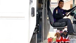 Driver Nava with his pups, Cocoa (left) and Chorizo (right) on their way to bring holiday cheer to the community. Driver Nava with his pups, Cocoa (left) and Chorizo (right) on their way to bring holiday cheer to the community.