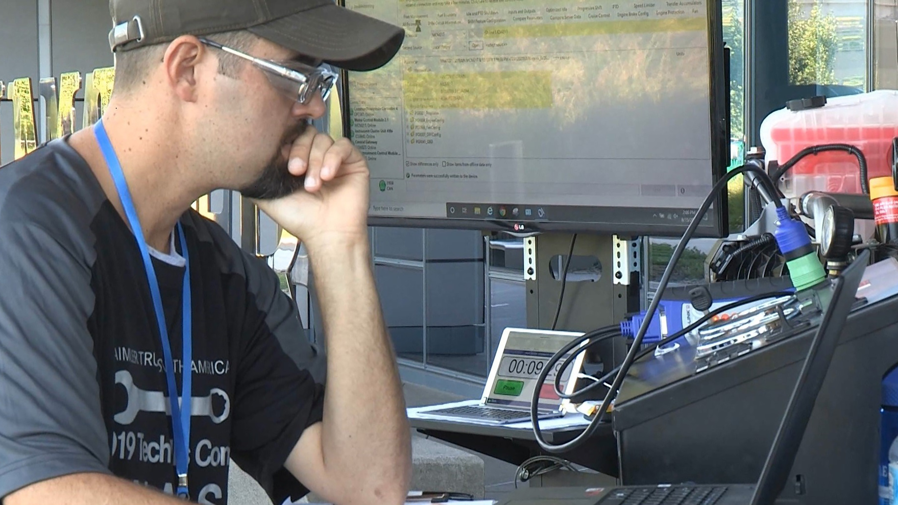 Truck technican Kyle Ballard troubleshoots an issue during DTNA's 2019 skills competition.