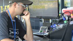 Truck technican Kyle Ballard troubleshoots an issue during DTNA's 2019 skills competition.