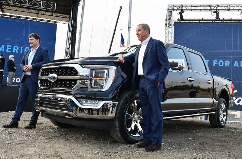 Ford COO Jim Farley (left) and executive chairman Bill Ford (right) show off the 2021 F-150. Farley is also the incoming CEO.