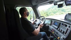 Truck Driver Wearing Mask In Cab Torc Robotics 5f7f7f1def80e Truck Driver Wearing Mask In Cab Torc Robotics 5f7f7f1def80e