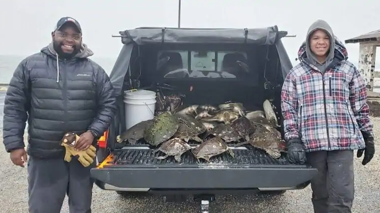 Will Bellamy (left) and his son Jerome (right) rescued sea turtles off the short of Texas.