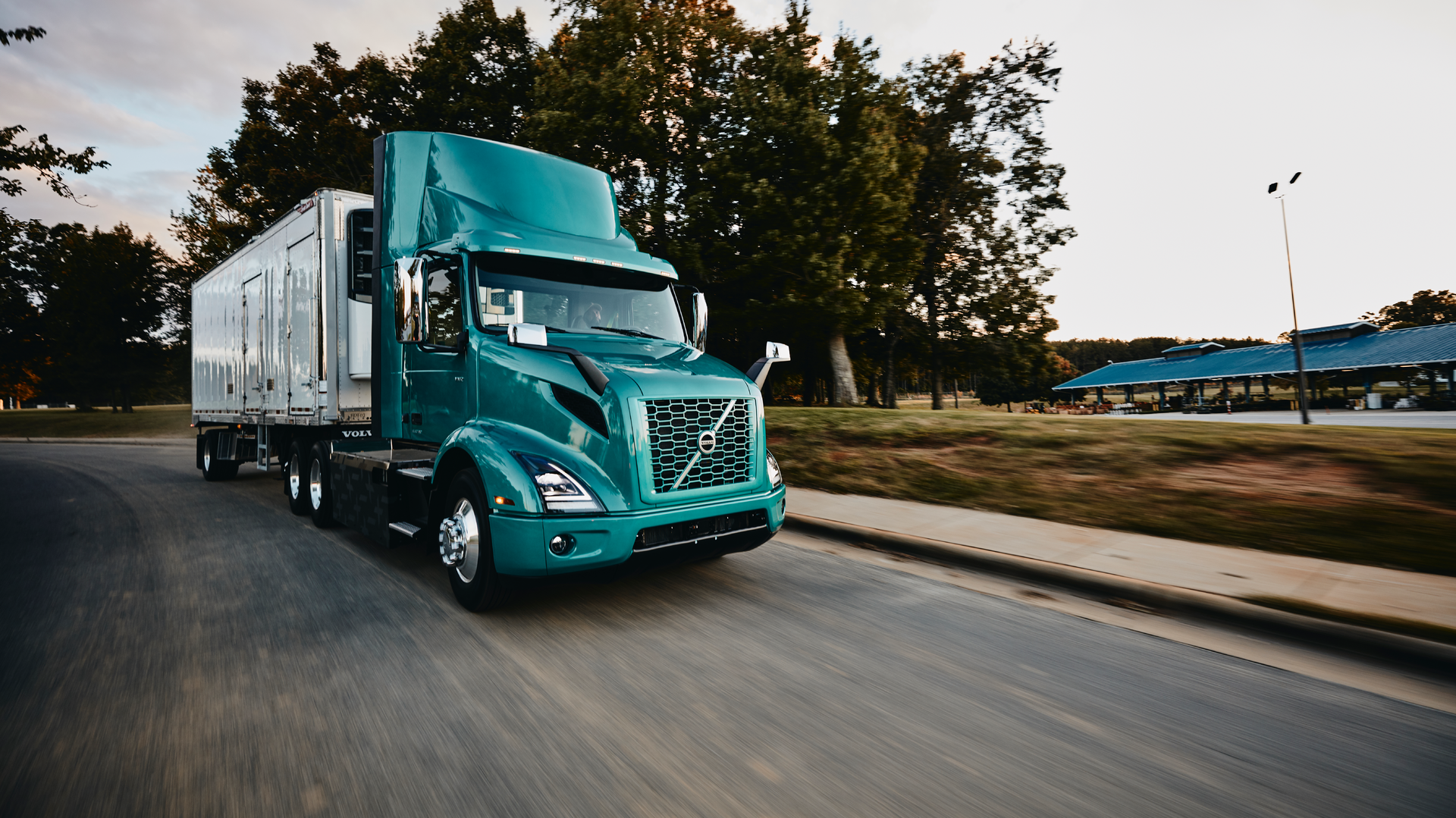 Volvo Vnr Electric 6x2 Tractor With Reefer Trailer Passenger Side View On The Road Daytime Shot 2 6058feda4c0b9