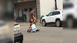Four-year-old Samuel Ray and UPS driver Matt Thomason. Four-year-old Samuel Ray and UPS driver Matt Thomason.