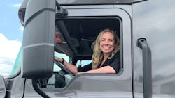 Erica Schueller in the cab of a truck at an media event. Erica Schueller in the cab of a truck at an media event.