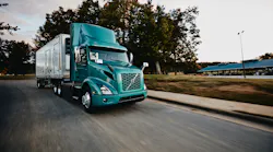 Volvo Vnr Electric 6x2 Tractor With Reefer Trailer Passenger Side View On The Road Daytime Shot 2