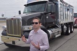 Standing in front of the new Model 548, Tony Sablar, Peterbilt vocational marketing manager, explains that the entire Peterbilt lineup now share a common electrical system, providing body manufacturers and upfitters a familiar platform for equipment installation. Standing in front of the new Model 548, Tony Sablar, Peterbilt vocational marketing manager, explains that the entire Peterbilt lineup now share a common electrical system, providing body manufacturers and upfitters a familiar platform for equipment installation.