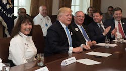 Rhonda Hartman next to President Donald Trump at the White House in 2017 talking about Infrastructure with the CEOs of the companies each driver represented. Rhonda Hartman next to President Donald Trump at the White House in 2017 talking about Infrastructure with the CEOs of the companies each driver represented.