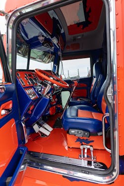 The interior of Brian Dreher's 2016 Peterbilt 389 sports a head-to-toe blue and orange color scheme. The interior of Brian Dreher's 2016 Peterbilt 389 sports a head-to-toe blue and orange color scheme.