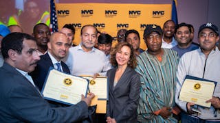 Meer Joshi, center, joins some of the safest livery drivers in New York City during the city&apos;s Taxi and Limousine Commission&apos;s 2018 Vision Zero Safety Honor Roll ceremony.