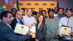 Meer Joshi, center, joins some of the safest livery drivers in New York City during the city's Taxi and Limousine Commission's 2018 Vision Zero Safety Honor Roll ceremony. Meer Joshi, center, joins some of the safest livery drivers in New York City during the city's Taxi and Limousine Commission's 2018 Vision Zero Safety Honor Roll ceremony.