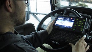 A driver logs into an electronic logging device. ELD usage became mandatory for most carriers during the Trump Administration.