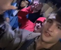 Nick Dirla, driver for UPS, with the eight others he rescued in his big brown truck. Nick Dirla, driver for UPS, with the eight others he rescued in his big brown truck.