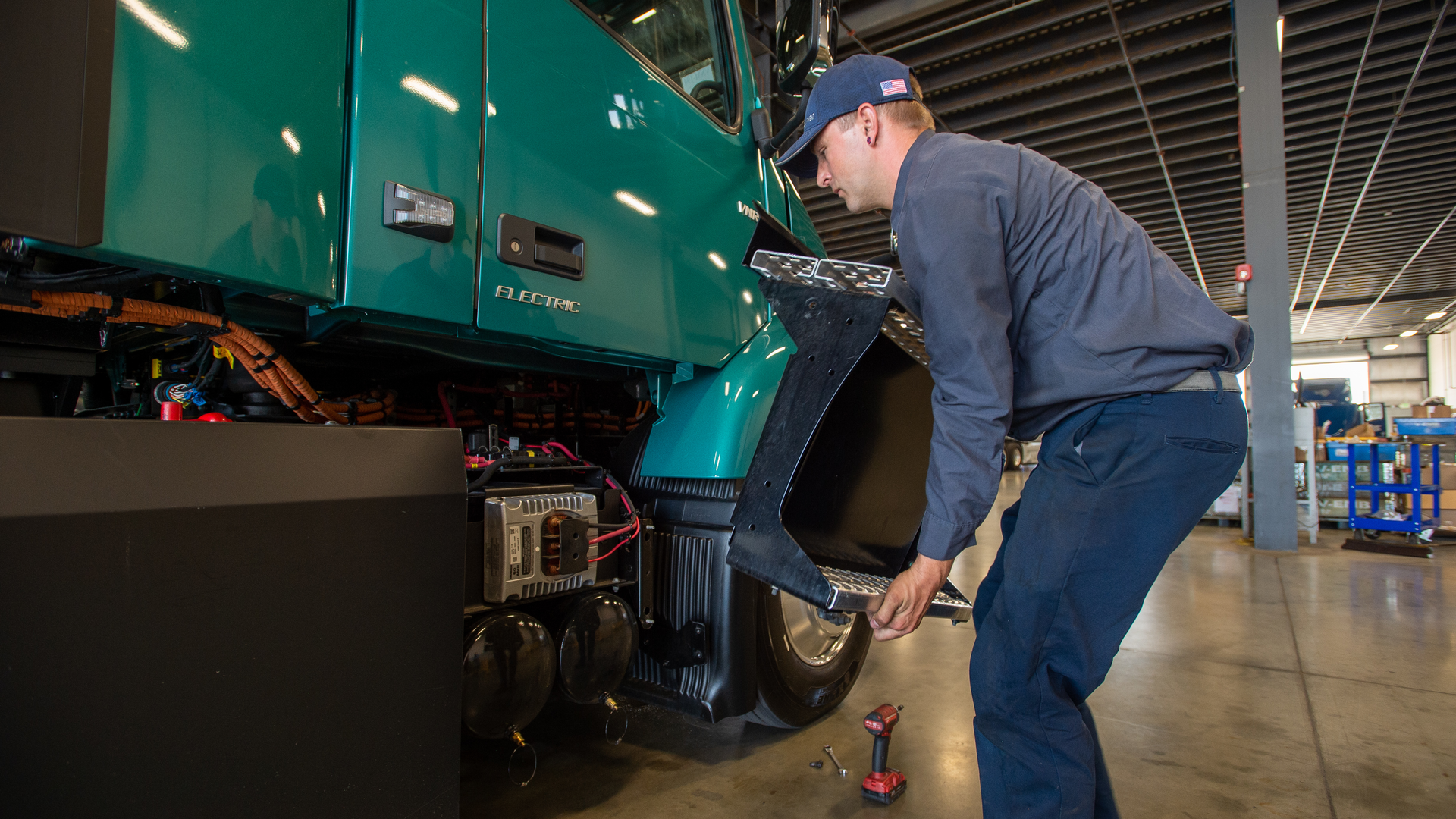 Vnr Electric Technician Removing Battery Cover 6160311f2a861