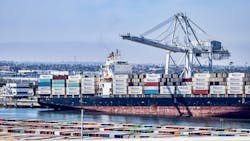 Cargo containers are processed from a ship at the Port of Los Angeles, which with the Port of Long Beach in California processes 40% of all the goods that come in and go out of the U.S. Cargo containers are processed from a ship at the Port of Los Angeles, which with the Port of Long Beach in California processes 40% of all the goods that come in and go out of the U.S.