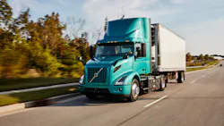 Volvo Vnr Electric 4x2 With Reefer Trailer Driver Side View On The Road 6183d7bdacb44
