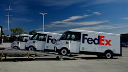The FedEx Express EV600s roll off the delivery truck.