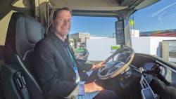Stephan Olsen, general manager of the Paccar Innovation Center, sits in a DAF XG+ at the Paccar exhibit during CES 2022 in Las Vegas.