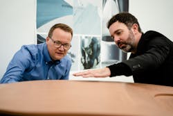 Darek Villeneuve (left) and Jeff Cotner observe the design of the SuperTruck II.