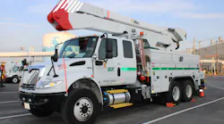 A BGE bucket truck, an International model equipped with an Altec aerial, including the Jobsite Energy Management System (JEMS) integrated plug-in system that uses stored energy to power the aerial device and provide exportable power.
