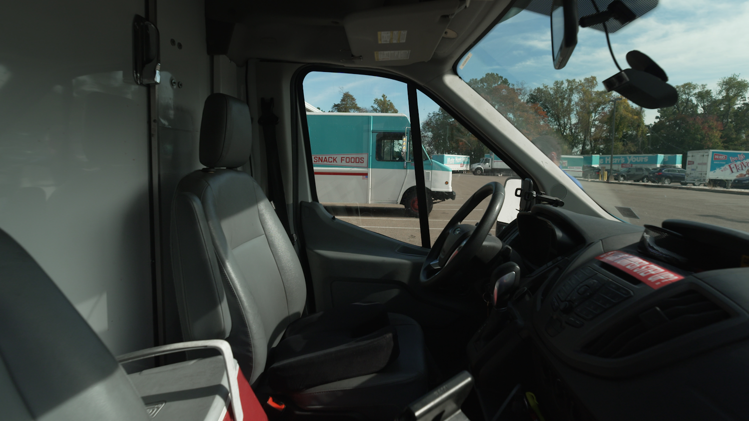 Nauto's dual-facing camera and AI system is housed inside the windshield. Nauto's dual-facing camera and AI system is housed inside the windshield.