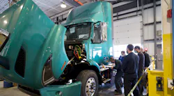 Technicians at Camions Volvo Montreal completing their required training on the Volvo VNR Electric as part of the Volvo Trucks EV Certified dealership designation.