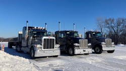 From left, a Peterbilt 389, equipped with the TX-12 transmission and 80,000 lb., a Peterbilt 579, equipped with the TX-18 transmission and 80,000 lb., and a Peterbilt 567, equipped with the TX-18 Pro and 140,000 lb., are lined up and ready to take on the Eaton proving grounds test track.