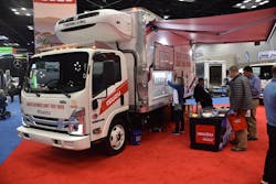 An Isuzu N-Series doubles a craft beer tap during Work Truck Week 2022 at the Indianapolis Convention Center.