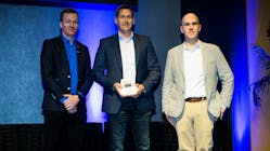 Michael Glover, senior director of shared services for PG&amp;E, accepts the 2022 FleetOwner 500 Private Fleet of the Year award during NPTC 2022. He is joined by Jean-Sebastien Bouchard of Isaac Instruments, the award sponsor, and Josh Fisher of FleetOwner.