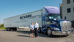 Jeffery Benore, fleet CEO and president, and VP Joan Benore have led Benore Logistic Systems since it was founded in 1994. They stand in front of their fleet&apos;s first Peterbilt Model 579EV tractor.