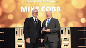 Landstar President and CEO Jim Gattoni (left) presenting Mike Cobb (right) with the Jeffrey C. Crowe-Robert E. Zonneville Lifetime Achievement Award.