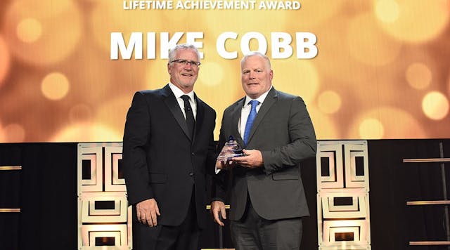 Landstar President and CEO Jim Gattoni (left) presenting Mike Cobb (right) with the Jeffrey C. Crowe-Robert E. Zonneville Lifetime Achievement Award.