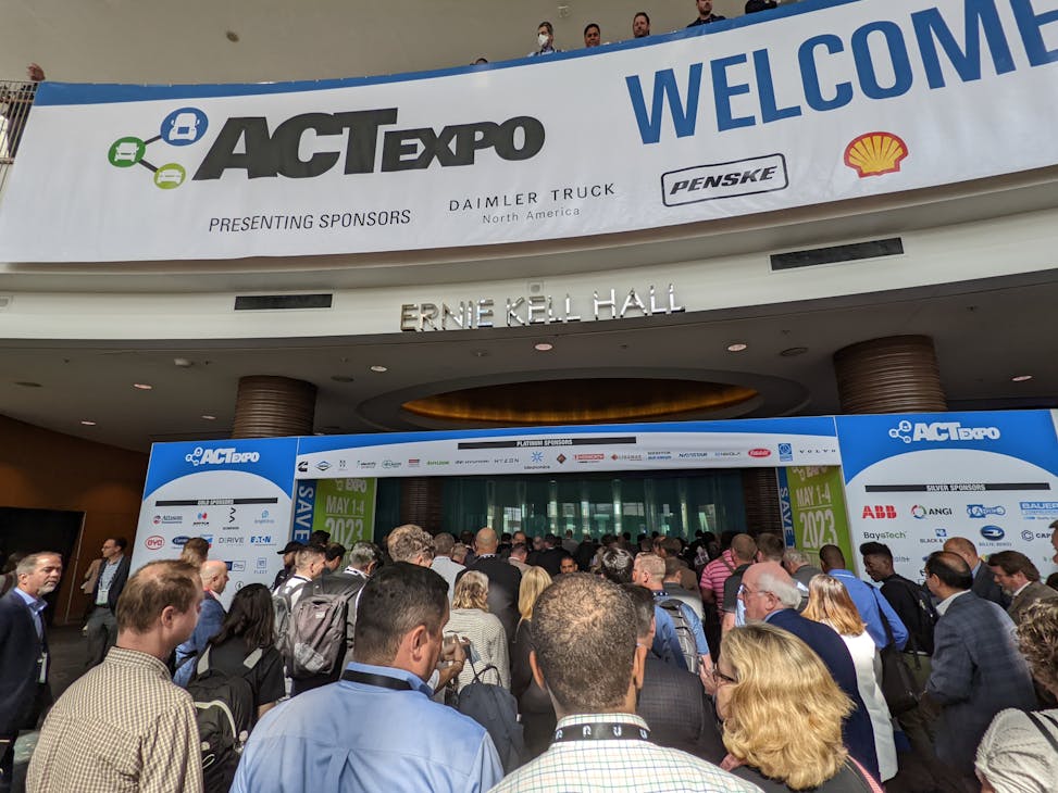 Attendees head to the exhibition floor opening at ACT Expo 2022 on May 9, 2022, in Long Beach, California.