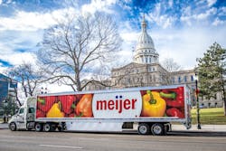A Meijer Logistics tractor-trailer makes a delivery for Hams For Hunger at the Michigan State Capitol in Lansing.