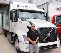 Pitt Ohio employee Joel Melon likes driving an electric truck on his urban route through Cleveland because it&apos;s quieter, offers a smoother ride, and there&apos;s no smell of diesel.