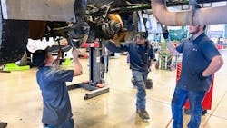 Diesel students at NVI-Blairsville perform hands-on wheel-end maintenance. The full program covers everything from electrical system basics to engine teardowns, and takes six months to complete.