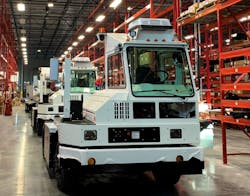 An Orange EV terminal tractor on the assembly line. An Orange EV terminal tractor on the assembly line.