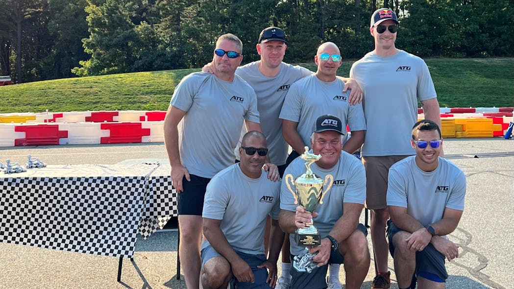 Advantage Truck Group and Robert B. Our&apos;s winning team of first responders from the Mashpee police and fire departments (from left): Eric Hersey, Kristian Oberg, Bryan Derochea, Nick Stecchi, Will Cuozzo, Advantage Truck Group President and CEO Kevin Holmes (with trophy) and Tyler Cuozzo.