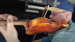 Crete Carrier driver Brian Lips makes use of his off-duty time in a uniquely creative way&mdash;he plays the violin.