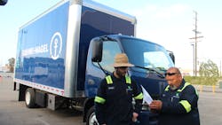 Zeem Solutions EV depot coordinators review paperwork for one of Kuehne+Nagel's battery-electric fleet vehicles that is maintained through Zeem's fleet-as-a-service offering in Los Angeles. Zeem Solutions EV depot coordinators review paperwork for one of Kuehne+Nagel's battery-electric fleet vehicles that is maintained through Zeem's fleet-as-a-service offering in Los Angeles.