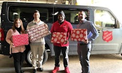 Helping to load the holiday gifts donated to The Salvation Army by Transervice are (left to right): Regina Snyder, claims and risk management administrator; Eric Zacharias, accounts receivable; a Salvation Army representative; and Sean Schnipper, director of marketing.