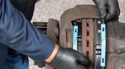 Kevin Pfost, Bendix’s coordinator of technical service, performs a brake inspection.