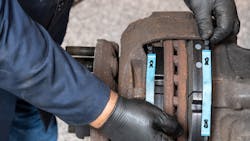 Kevin Pfost, Bendix’s coordinator of technical service, performs a brake inspection. Kevin Pfost, Bendix’s coordinator of technical service, performs a brake inspection.