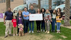 Swift Transportation presents Phoenix Children's Hospital in Arizona with a check for the amount drivers and driving support team members donated throughout the year. Driver Casey S. (left) received the keys to a new wrapped Kenworth tractor. Swift Transportation presents Phoenix Children's Hospital in Arizona with a check for the amount drivers and driving support team members donated throughout the year. Driver Casey S. (left) received the keys to a new wrapped Kenworth tractor.