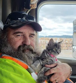 Bryan Larrea holds his and Nikki's pet cat. Bryan Larrea holds his and Nikki's pet cat.