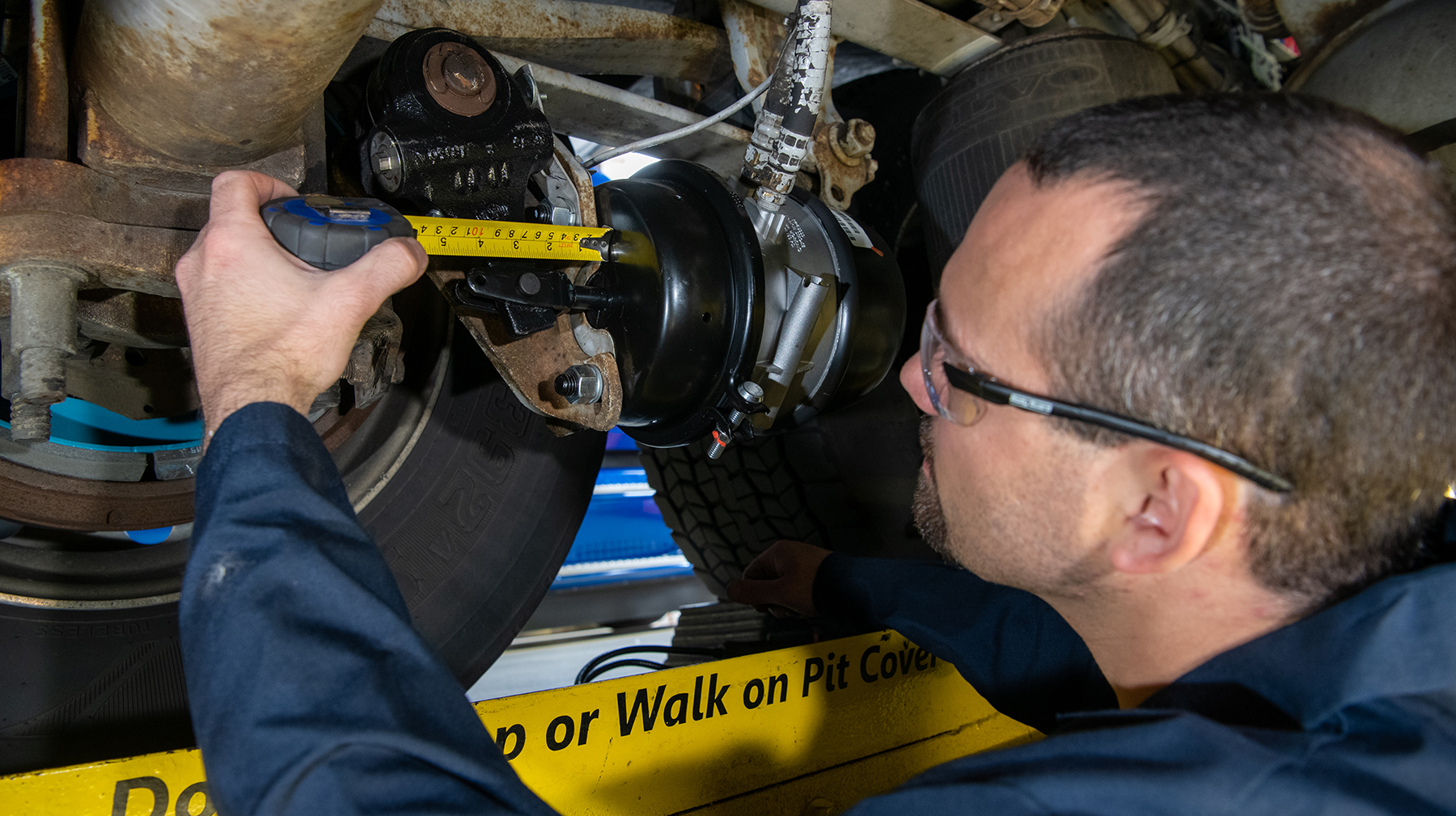 During roadside examinations, inspectors measure brake strokes at 90 to 100 psi of application pressure.
