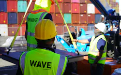 A team installs a Wave Charging pad at the Port of Los Angeles, providing opportunity charging to extend vehicle range.