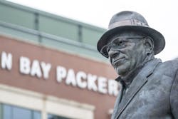 A statue of Vince Lombardi outside Lambeau Field in Green Bay, Wisconsin. A statue of Vince Lombardi outside Lambeau Field in Green Bay, Wisconsin.
