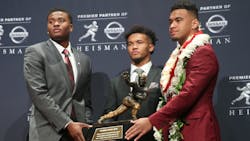 Ohio State Buckeyes quarterback Dwayne Haskins, left, Oklahoma Sooners quarterback Kyler Murray and Alabama Crimson Tide quarterback Tua Tagovailoa pose with the Heisman Trophy at the Marriott Marquis in New York City in 2018. Ohio State Buckeyes quarterback Dwayne Haskins, left, Oklahoma Sooners quarterback Kyler Murray and Alabama Crimson Tide quarterback Tua Tagovailoa pose with the Heisman Trophy at the Marriott Marquis in New York City in 2018.
