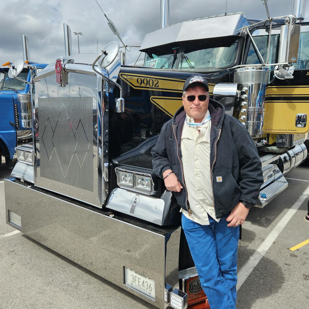 John McCormick, an owner-operator driving for Oakley Trucking, next to his 2021 Kenworth W900L, nicknamed &apos;Bandit,&apos; which won second place at the 2023 Mid-America Trucking Show&apos;s PKY Truck Beauty Championship for its cab interior.